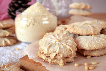 Fototapeta na wymiar Meringue cookies with pine nuts and almonds 