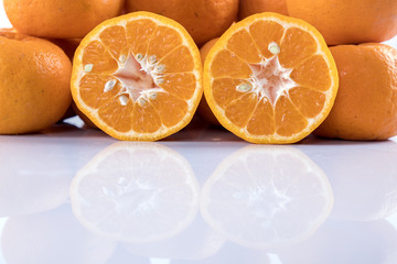 Fototapeta premium Isolated orange mandarin that is synonymous with the Chinese New Year celebration in the white background