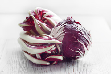 Fototapeta premium Radicchio of Treviso red chicory on white board.