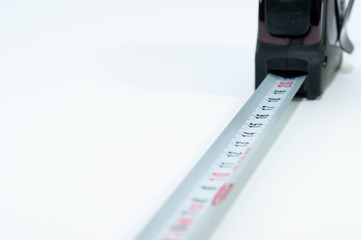 Tape measurer close up macro shot isolated on white background.