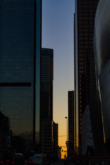 Downtown Los Angeles at Sunset with light reflecting on the glass buildings.