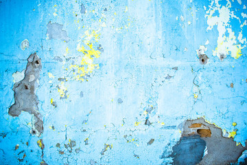 Texture of the plaster. Old plaster with dirty paint. Background. The texture of the shabby paint and gypsum cracks. The wall is painted with old blue paint. An old concrete wall.