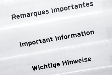 Pages with words Important Information in three different  languages.