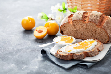 Homemade bread with yellow plum jam, selective focus