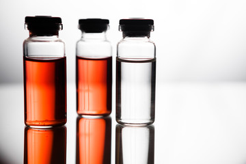 Group of ampoules with a transparent medicine in medical laboratory