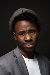 Portrait of attractive young black male studio on dark background