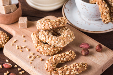 cookies with peanuts, wooden board, nuts