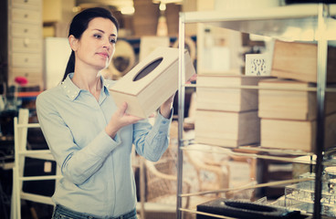 Woman standing with wooden box