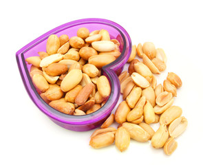 Processed peanuts isolated in bowl on white background