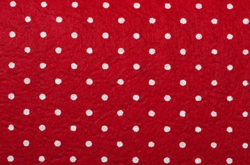 Red polka dot felt material background.