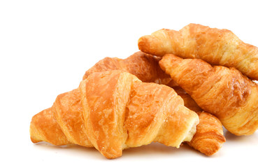 Fresh and tasty croissant over white background