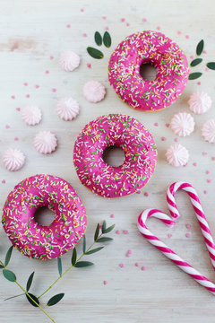  Marshmallows; donuts with strawberries and lollies on a light background