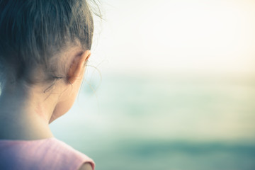 Concept, abstract image of beautiful little girl at the beach.