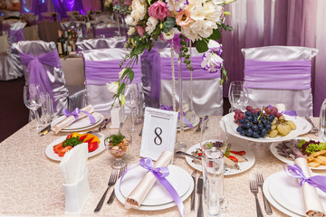 A decorated wedding table with room number eight. Served wedding table.