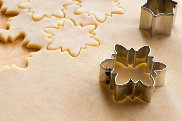 Cutting out star shapes for Linzer Christmas cookies