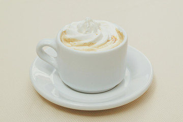 cup of coffee and cream on white background