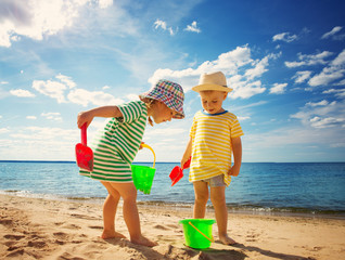 Boy and girl playing on the beach