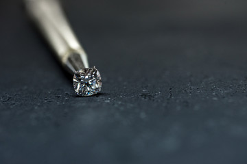 Cushion Cut Diamond in Tweezers