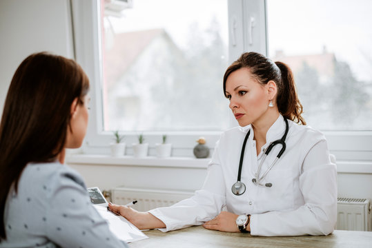 Female doctor having serious conversation with patient