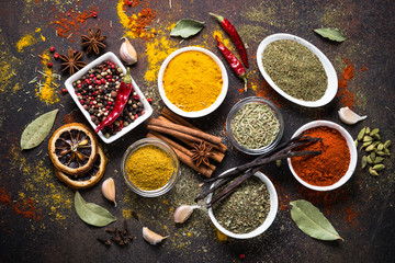 Set of Various spices on dark stone table. Top view. Food background.
