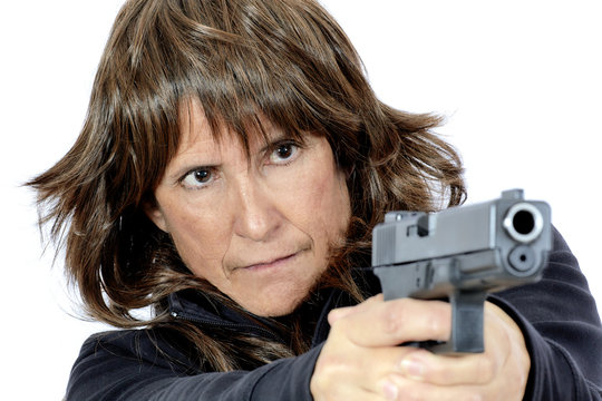Mature Woman shooting a Handgun