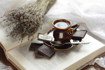 a cup of coffee, a book