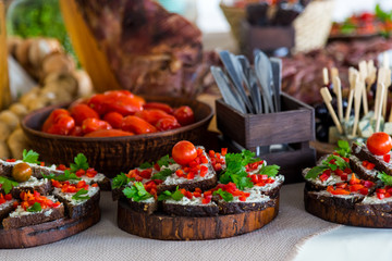 Banquet Table in restaurant served with different meals red