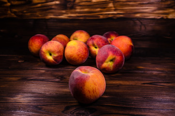 Fresh ripe peaches on wooden table