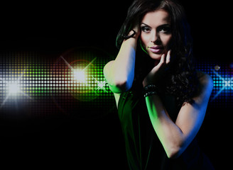 Naklejka premium Portrait of dancing girl on disco party.