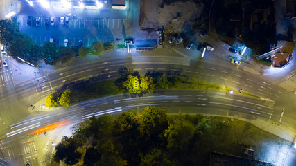 Night aerial view of straight road in the city 