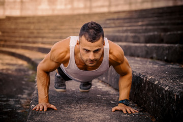 Athletic man doing push ups