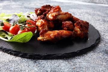 crispy barbecue chicken wings bbq on grey background