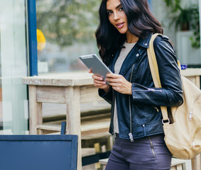 Young pretty spanish woman in cafe in city centre