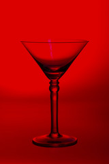Martini glass high key photo in studio with red tint