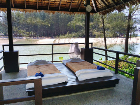 The massage pavilion with beds for rest on the sandy beach. Thailand..