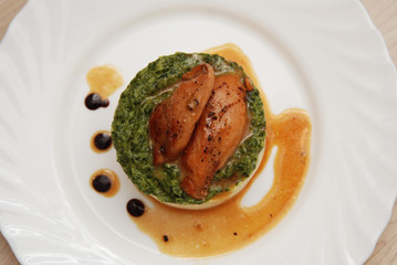 Roasted Chicken Breast and Mashed Potatoes with Spinach Sauce in White Plate. top view.