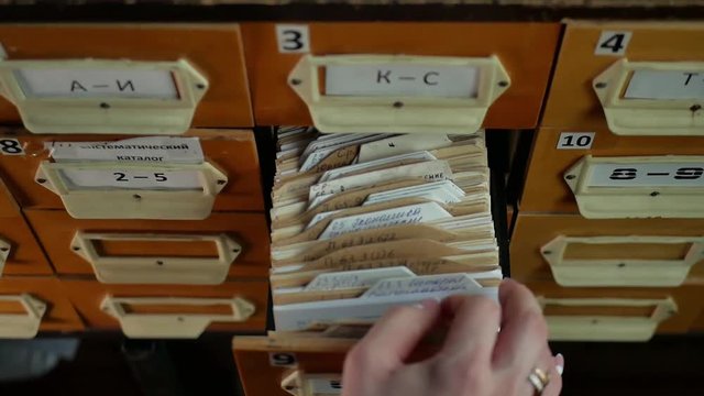 Old archive with wooden drawers. database concept. Vintage cabinet. library card or file catalog.