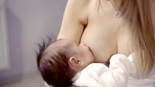 Little girl is sucking milk