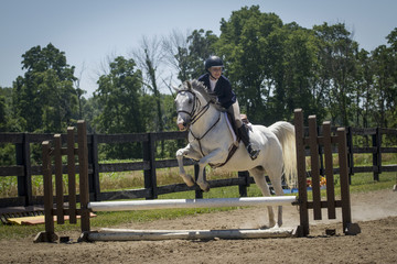 Woman jumps arabian cross