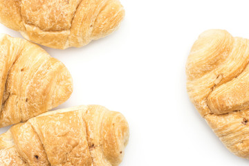 Four croissants or cornetto background isolated on white (top view).