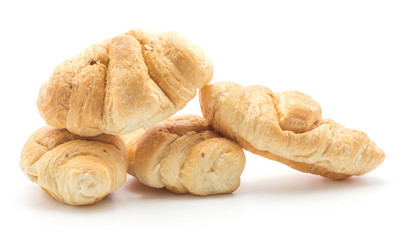 Baked croissants or cornetto stack isolated on white background four whole.
