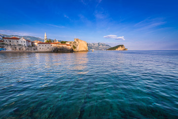 Old Town citadel in Budva town over Adriatic Sea, Montenegro. Island of Saint Nicholas on background