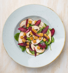 Top view of vegan mixed salad in plate