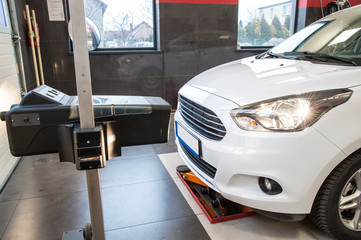 headlight adjustment / headlight adjustment in a car by an authorized service