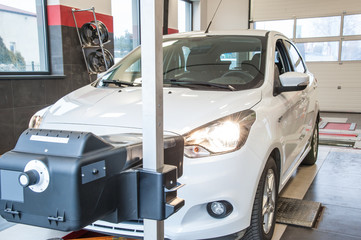 headlight adjustment / headlight adjustment in a car by an authorized service