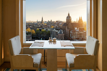 Modern luxury restaurant interior with romantic sence Amsterdam old town view in Amsterdam,...