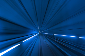 Speed blurred motion of train or subway train moving inside tunnel.