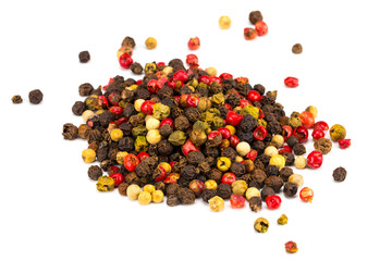 Black, red and white peppercorns isolated on white background. Heap of spice. Mix of different peppers