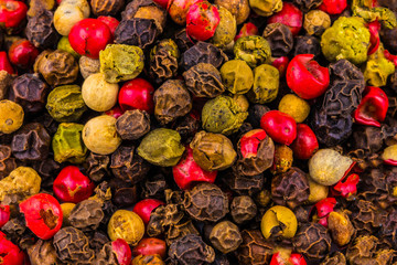  Mix of different peppers.Black, red and white peppercorns - food spicy background