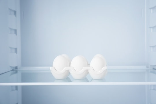 Raw eggs in empty refrigerator